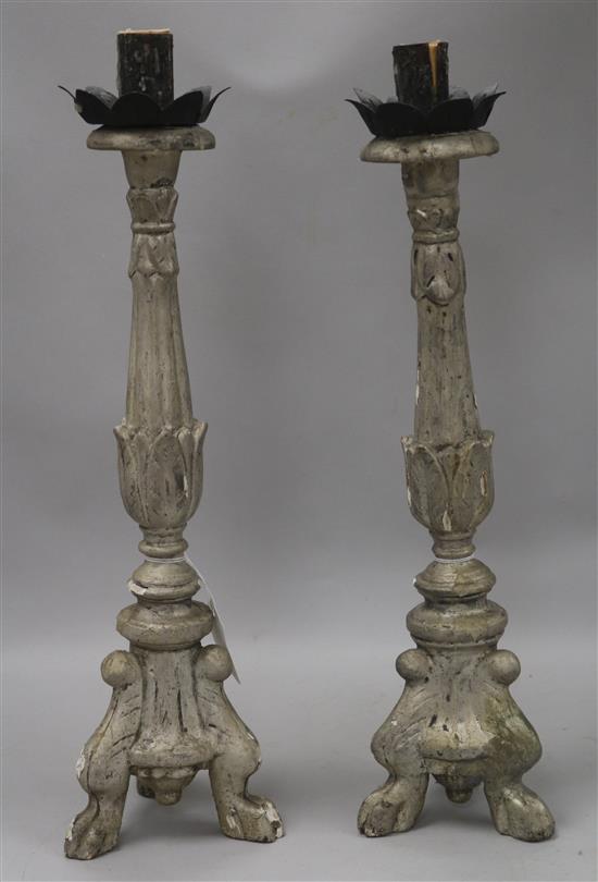 A pair of Renaissance style carved and silvered wood candlesticks H approx 49cm